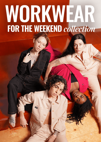 Four people sit on wood platform wearing pieces from the workwear collection including a black coverall, a natural denim coverall, a berry coverall, and the natural denim utility jacket. Text overlay on image says Workwear for the weekend collection.