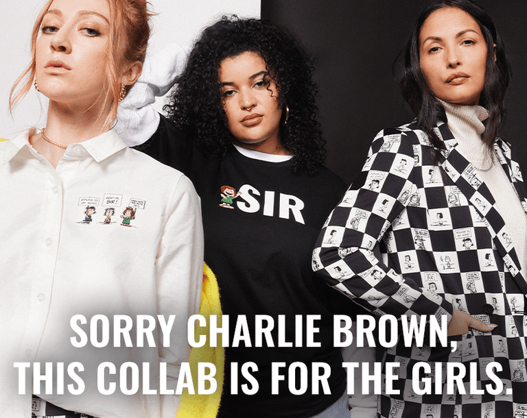 Three people stand in front of black and white background wearing pieces from the PEANUTS X WILDFANG collection. Text overlay reads "Sorry Charlie Brown, this collab is for the girls"