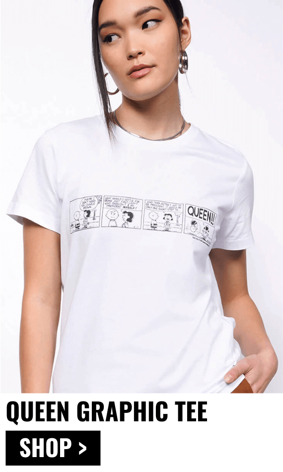 Person modeling the PEANUTS X WILDFANG Queen Graphic Tee with overlay text that reads QUEEN GRAPHIC TEE and button that reads SHOP.