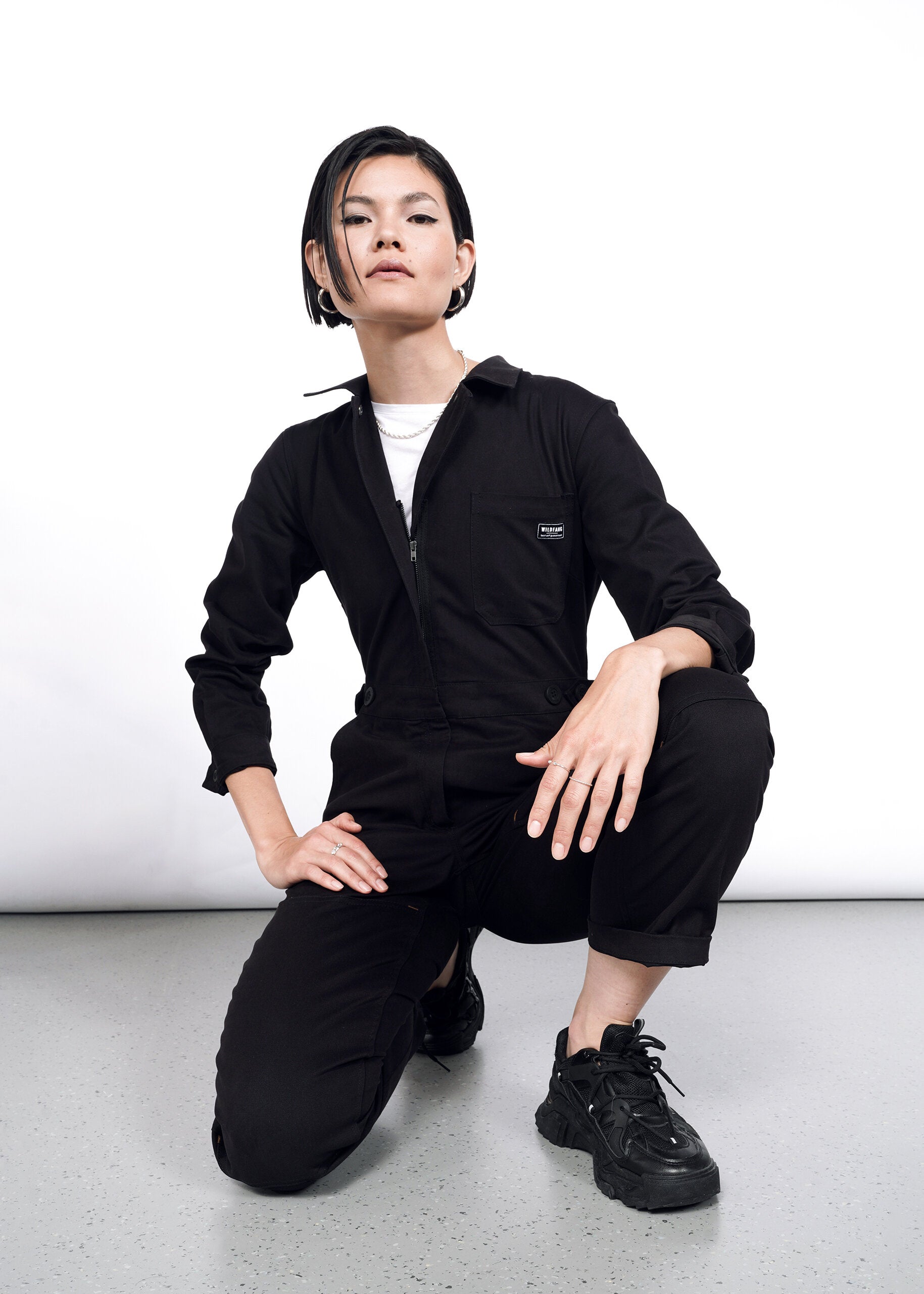 Model wearing The Essential Long Sleeve High Waisted Coverall in Black