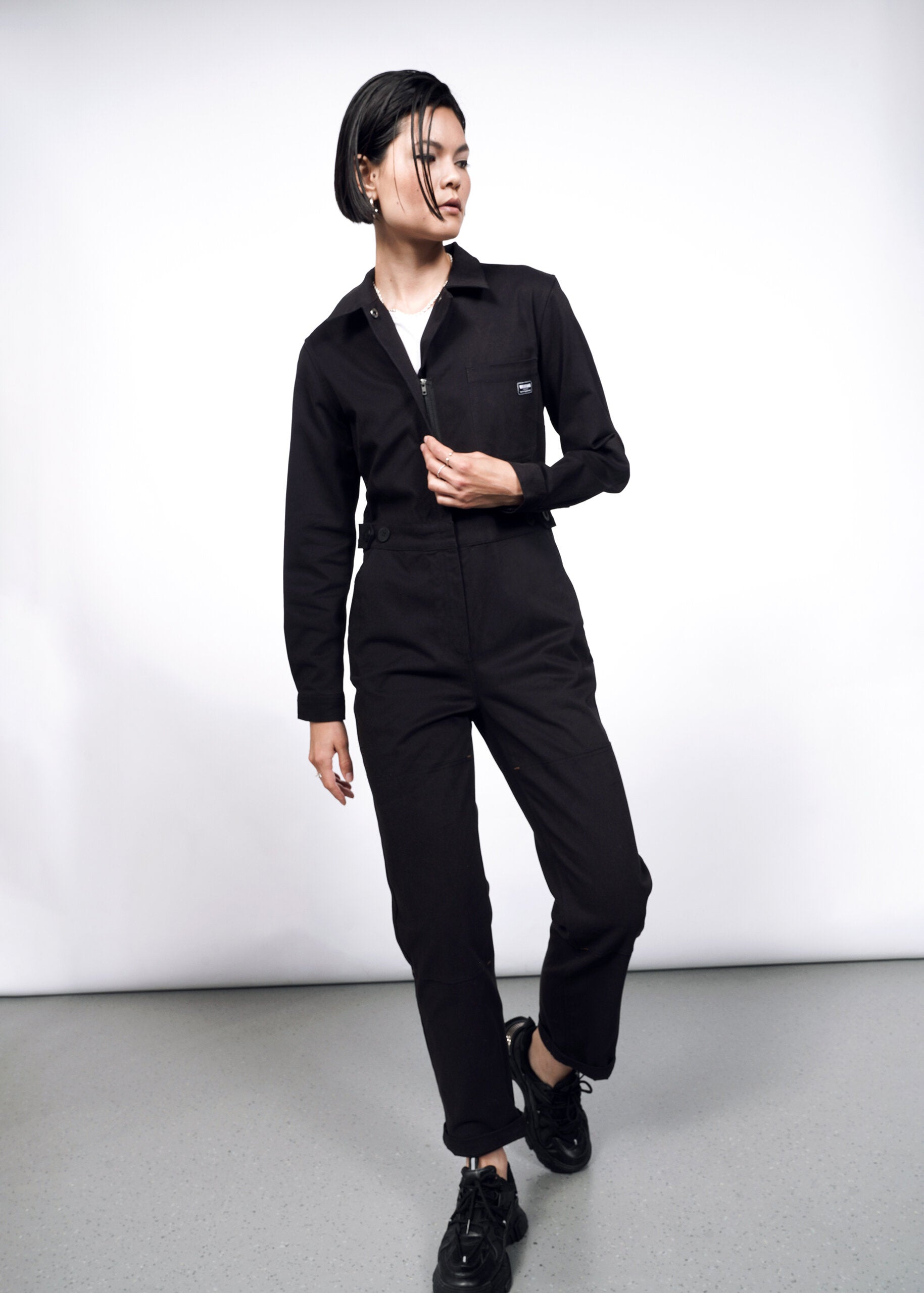 Model wearing The Essential Long Sleeve High Waisted Coverall in Black