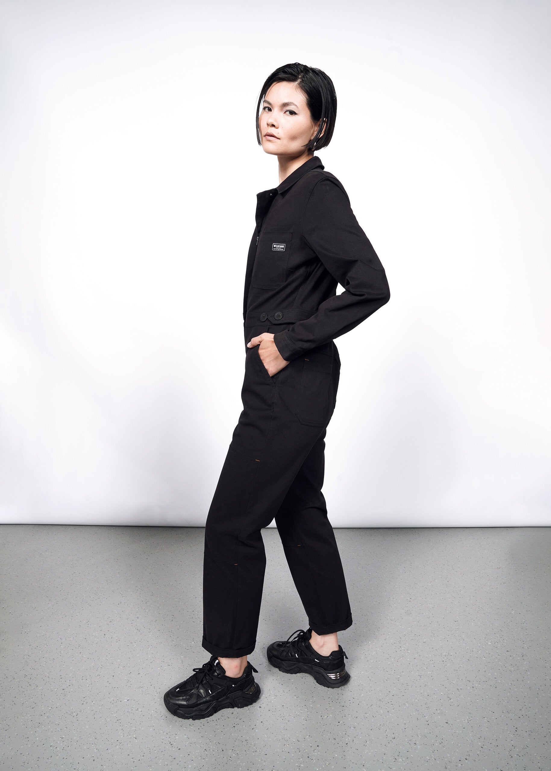 Model wearing The Essential Long Sleeve High Waisted Coverall in Black