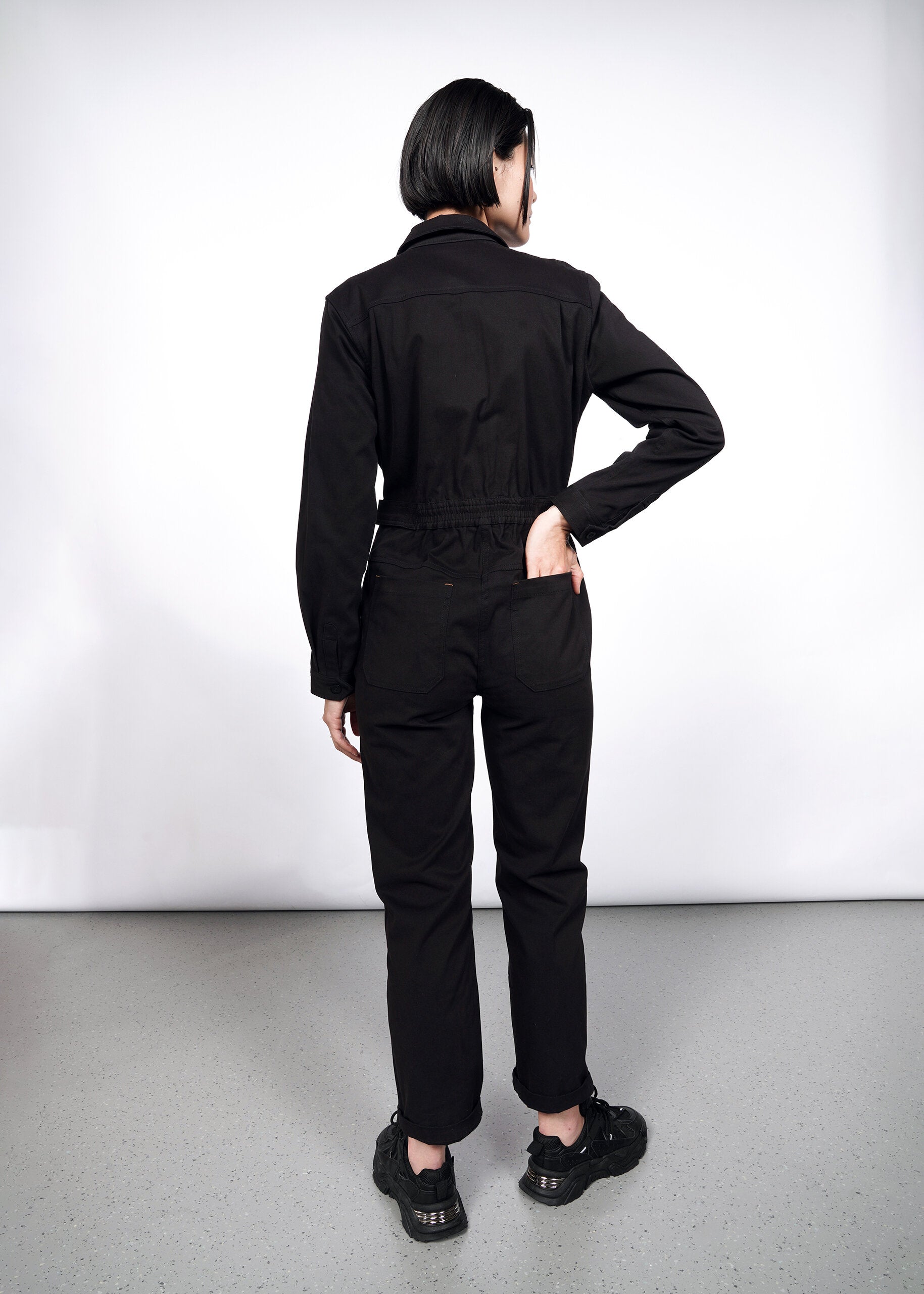 Model wearing The Essential Long Sleeve High Waisted Coverall in Black